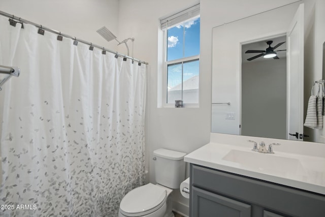 bathroom with toilet, walk in shower, and vanity