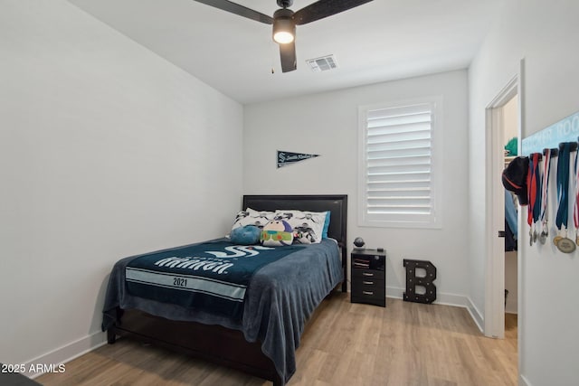 bedroom featuring ceiling fan and light hardwood / wood-style floors