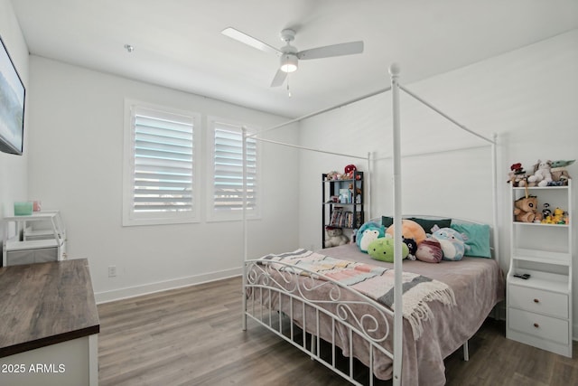 bedroom featuring wood-type flooring and ceiling fan