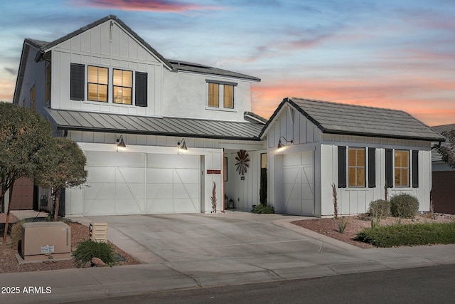 modern farmhouse style home featuring a garage