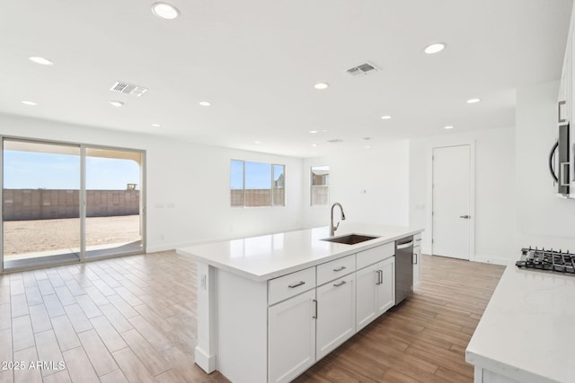 10241 E Ursula Ave, Mesa, AZ 85212 - kitchen featuring a sink, stainless steel appliances, light wood finished floors, recessed lighting, and white cabinetry