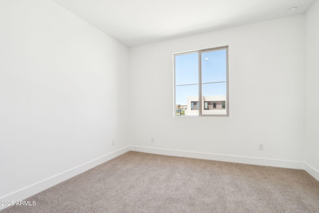10241 E Ursula Ave, Mesa, AZ 85212 - empty room featuring baseboards and light carpet