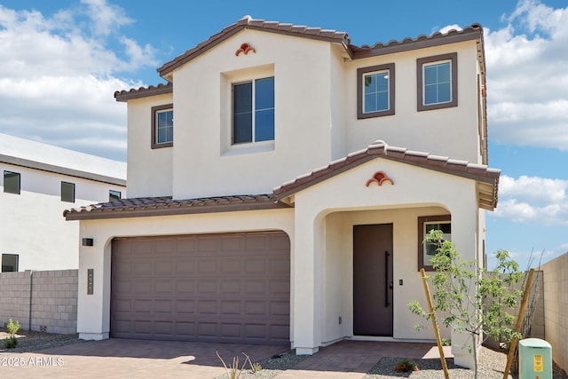 10241 E Ursula Ave, Mesa, AZ 85212 - mediterranean / spanish home with an attached garage, a tiled roof, stucco siding, and driveway