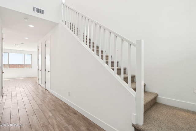 10241 E Ursula Ave, Mesa, AZ 85212 - stairway with baseboards, wood finished floors, and recessed lighting