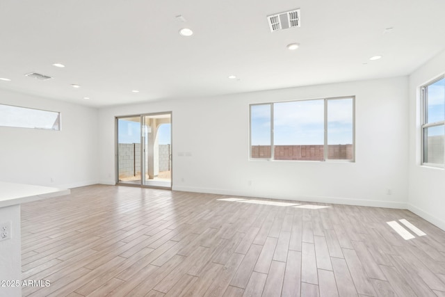 10241 E Ursula Ave, Mesa, AZ 85212 - spare room with light wood-type flooring, recessed lighting, and baseboards