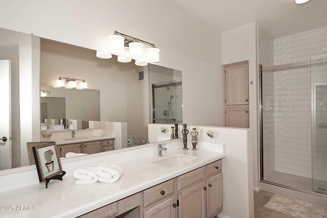 bathroom featuring vanity, toilet, walk in shower, and tile patterned flooring