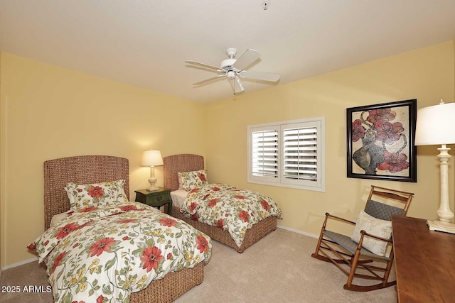 bedroom featuring light carpet and ceiling fan