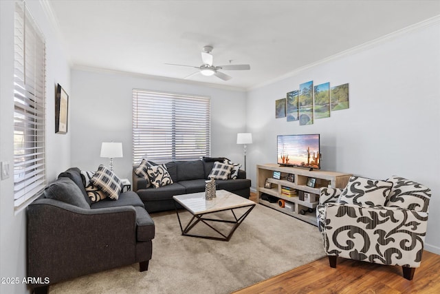 living room featuring ceiling fan, crown molding, and hardwood / wood-style flooring