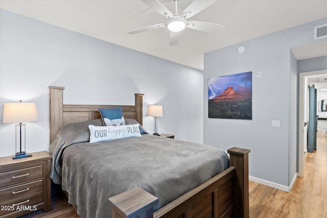 bedroom with ceiling fan and light hardwood / wood-style flooring