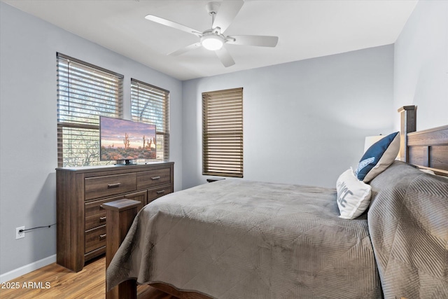 bedroom featuring ceiling fan and light hardwood / wood-style floors