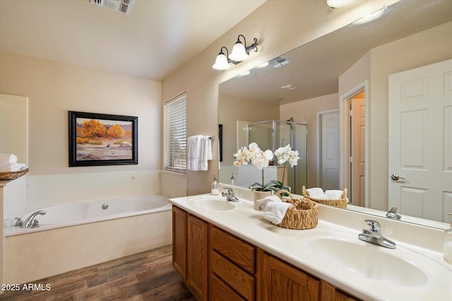 3658 E Pony Track Ln, San Tan Valley, AZ 85140 - full bathroom featuring wood finished floors, a stall shower, a bath, and double vanity