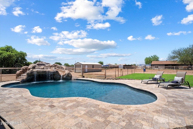 3658 E Pony Track Ln, San Tan Valley, AZ 85140 - outdoor pool featuring a patio area and an outbuilding