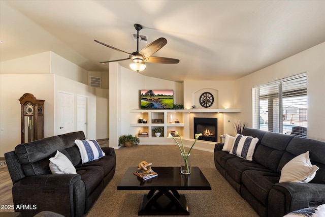 3658 E Pony Track Ln, San Tan Valley, AZ 85140 - living room with a tile fireplace, a ceiling fan, carpet flooring, and lofted ceiling