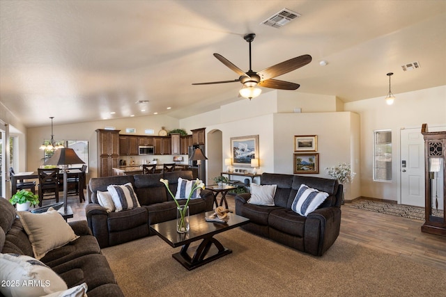 3658 E Pony Track Ln, San Tan Valley, AZ 85140 - living area featuring vaulted ceiling, wood finished floors, ceiling fan, and arched walkways