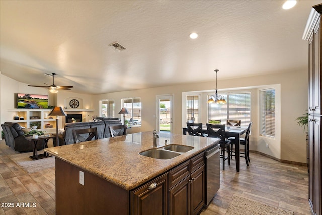 3658 E Pony Track Ln, San Tan Valley, AZ 85140 - kitchen with a sink, dishwasher, light wood-style flooring, a center island with sink, and recessed lighting