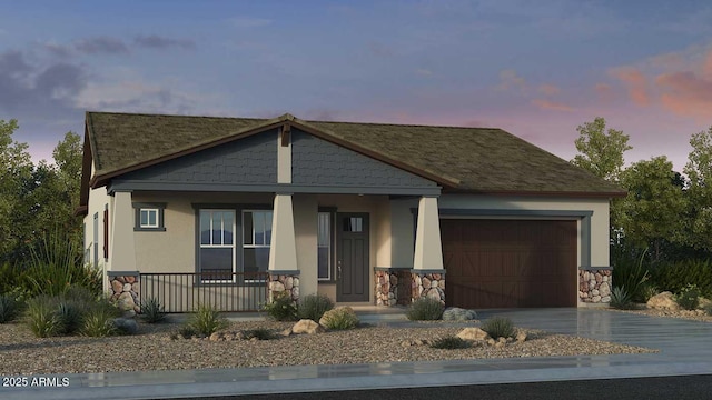 view of front of property featuring a garage and covered porch