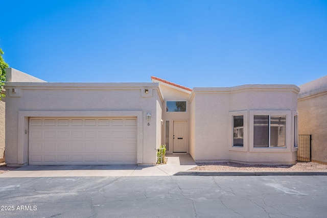 2647 N Miller Rd Unit 6, Scottsdale, AZ 85257 - view of front of home featuring stucco siding and a garage