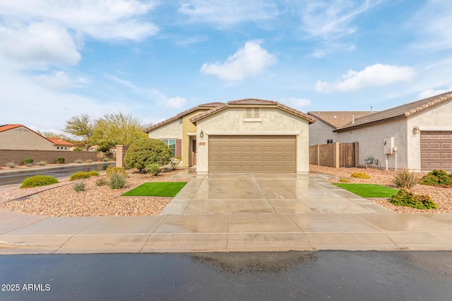 5590 W Victory Way, Florence, AZ 85132 - ranch-style home with driveway, a garage, and stucco siding