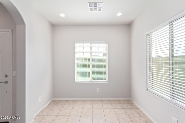 5590 W Victory Way, Florence, AZ 85132 - unfurnished room with arched walkways, light tile patterned flooring, baseboards, and recessed lighting