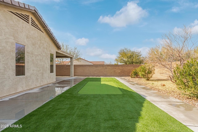 5590 W Victory Way, Florence, AZ 85132 - view of yard featuring a putting green and a patio area