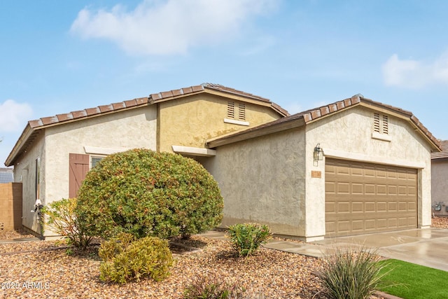 5590 W Victory Way, Florence, AZ 85132 - view of front of property with a garage, driveway, and stucco siding