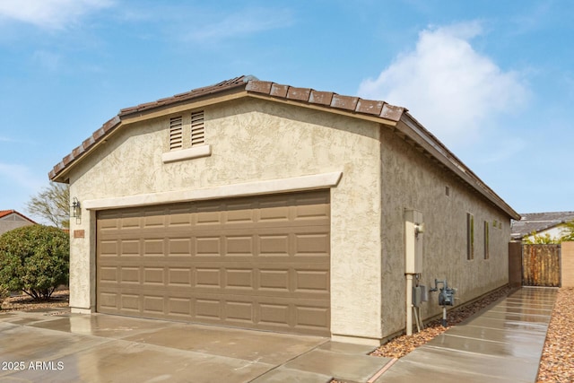 5590 W Victory Way, Florence, AZ 85132 - view of home's exterior featuring stucco siding and an attached garage