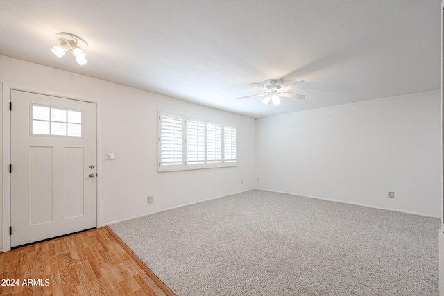 entryway with plenty of natural light, ceiling fan, and light wood-type flooring