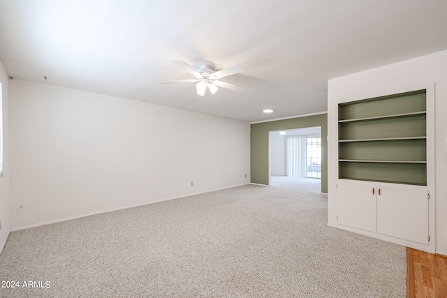 unfurnished living room featuring light wood-type flooring and ceiling fan