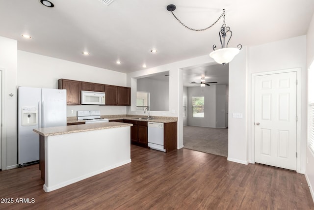 21182 E Stonecrest Dr, Queen Creek, AZ 85142 - kitchen featuring white appliances, light countertops, dark wood-style flooring, and recessed lighting