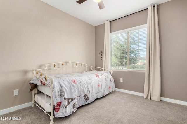 bedroom with ceiling fan and carpet