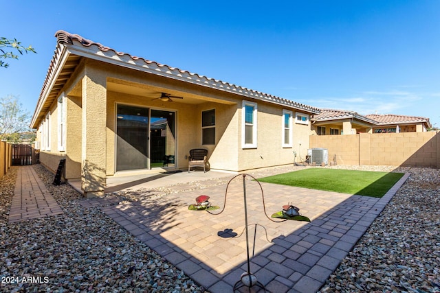 rear view of property with a patio, ceiling fan, and central air condition unit