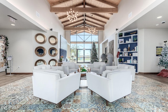 living room with beamed ceiling, a notable chandelier, wood-type flooring, and high vaulted ceiling