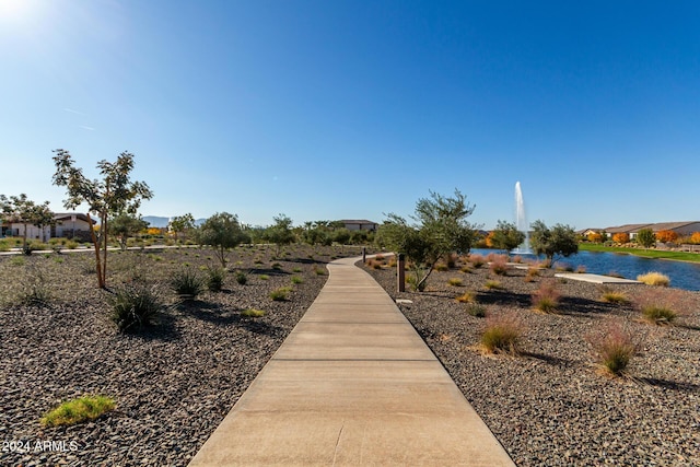 surrounding community featuring a water view