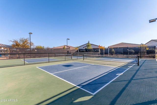 view of sport court with basketball hoop