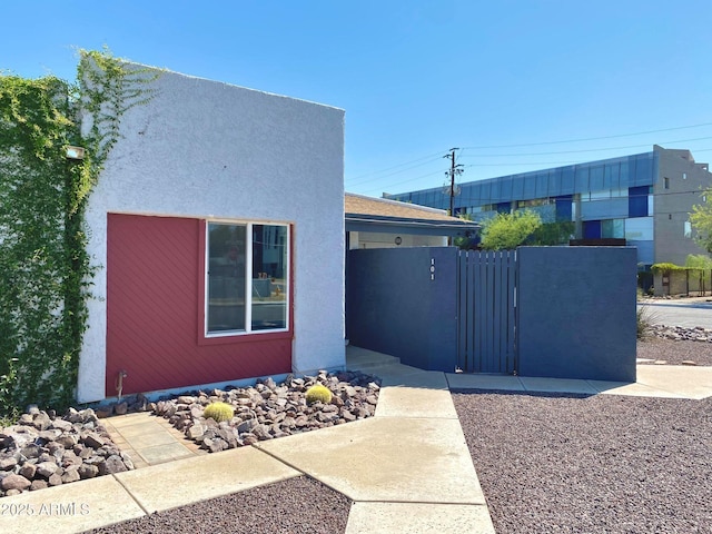 3551 N 12th St Unit 101, Phoenix, AZ 85014 - view of front of house featuring a gate and stucco siding