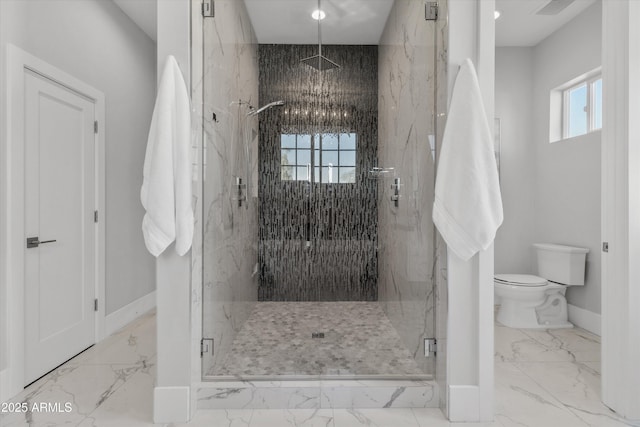 bathroom featuring walk in shower, a wealth of natural light, and toilet