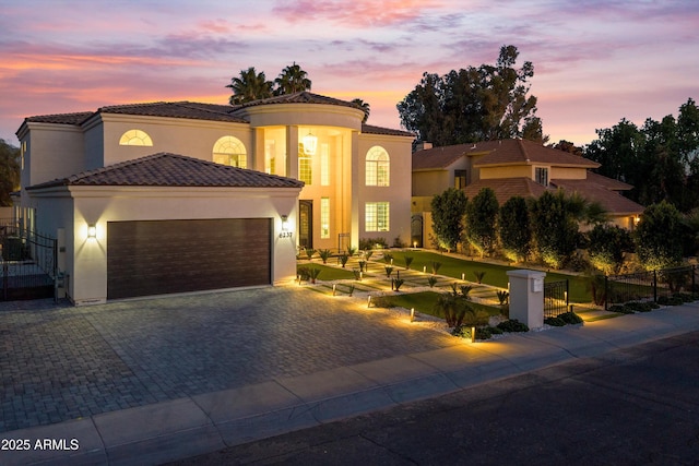 mediterranean / spanish-style house featuring a garage