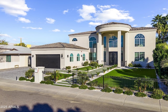 mediterranean / spanish-style house featuring a garage