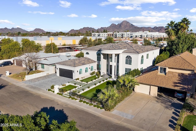 birds eye view of property featuring a mountain view