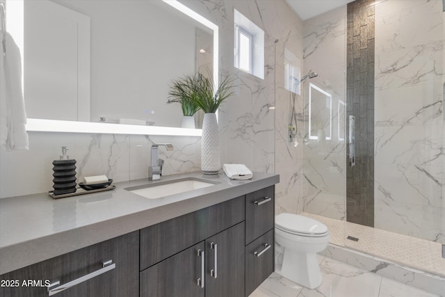 bathroom with toilet, a shower with shower door, and vanity