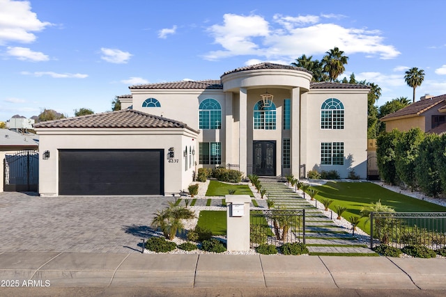 mediterranean / spanish home featuring a garage