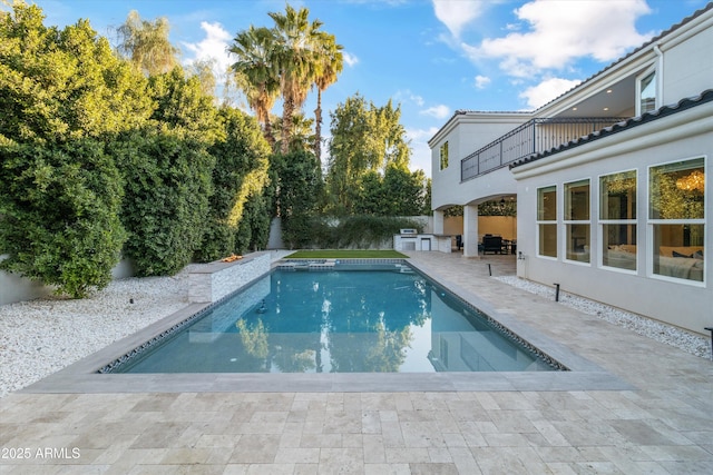 view of swimming pool featuring a patio