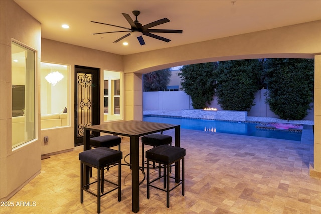 exterior space with ceiling fan