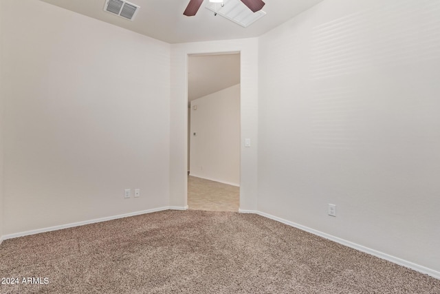 spare room with light colored carpet and ceiling fan