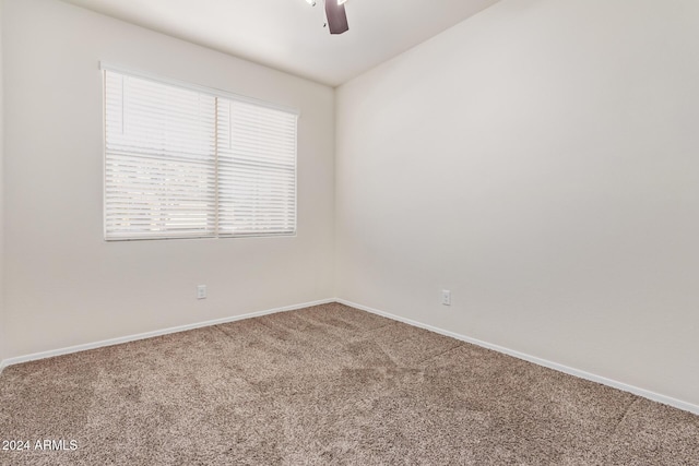 empty room with carpet floors and ceiling fan