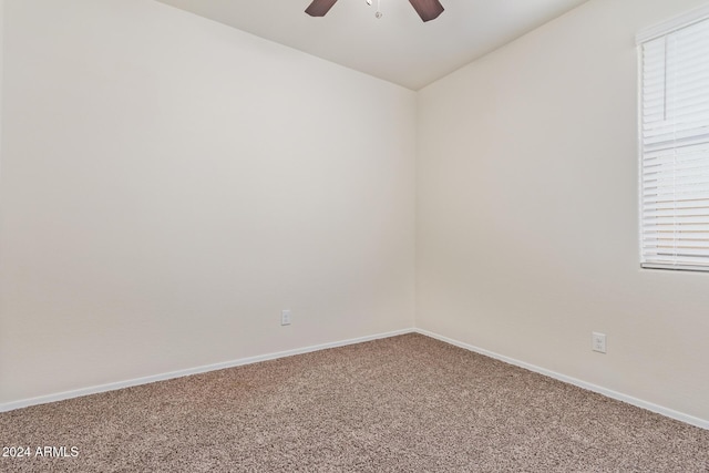 unfurnished room with carpet floors and ceiling fan