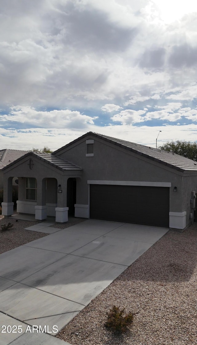 ranch-style home with a garage