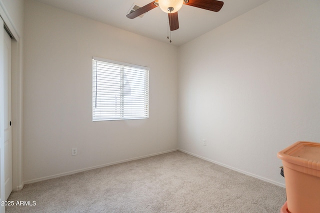 1956 N Hubbard Ln, Casa Grande, AZ 85122 - spare room featuring a ceiling fan, baseboards, and light colored carpet