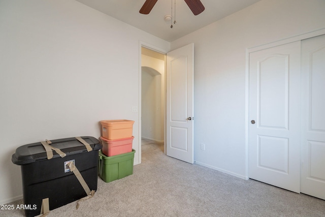 1956 N Hubbard Ln, Casa Grande, AZ 85122 - unfurnished bedroom with carpet floors, baseboards, ceiling fan, and a closet