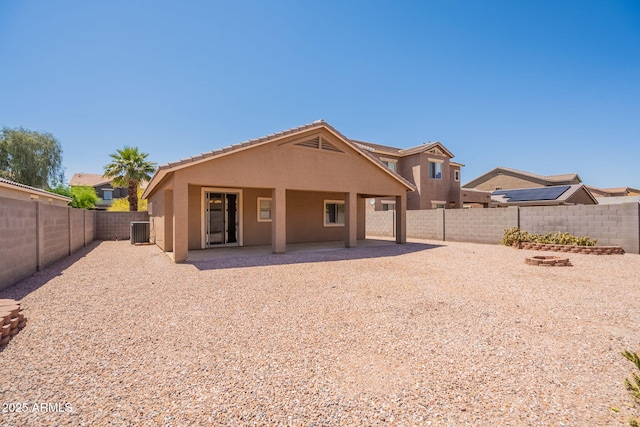 1956 N Hubbard Ln, Casa Grande, AZ 85122 - rear view of property featuring a fenced backyard, a patio area, stucco siding, and cooling unit